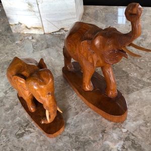 Rare hand carved teak elephants.